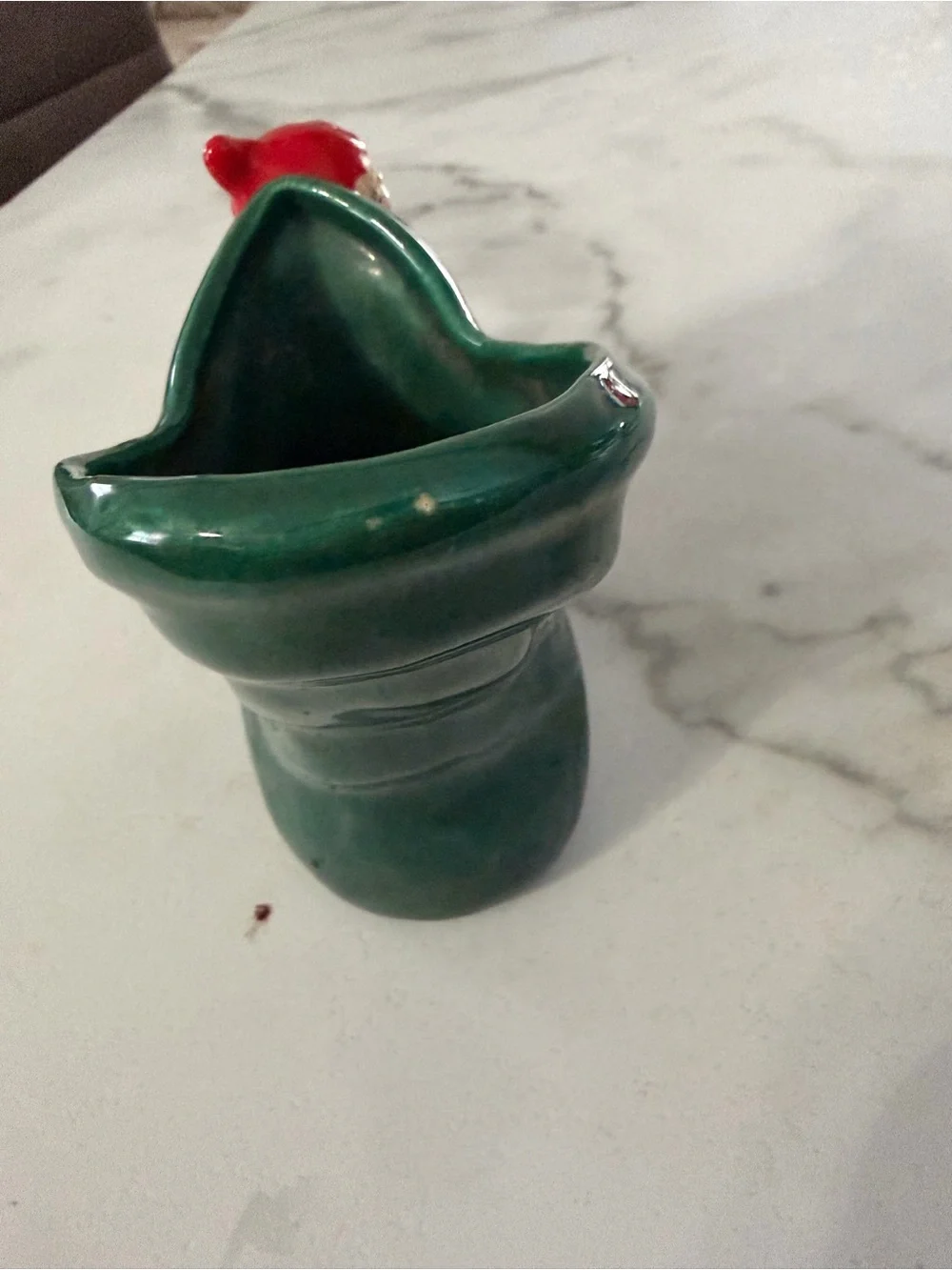 Vintage mid century ceramic pixie elf on a green boot 1950s
